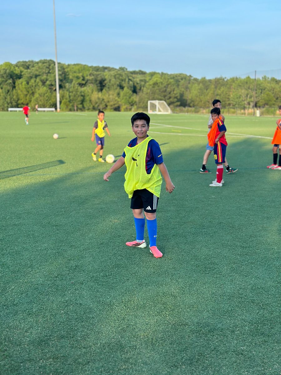 Youth player on turf